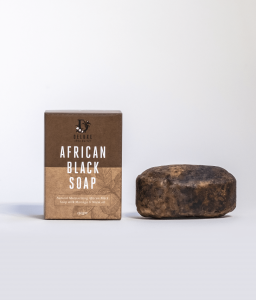 Deluxe African Black Soap bar next to product box.
