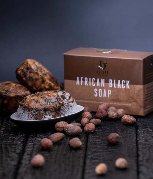 African Black Soap three pack on wooden table with Shea nuts